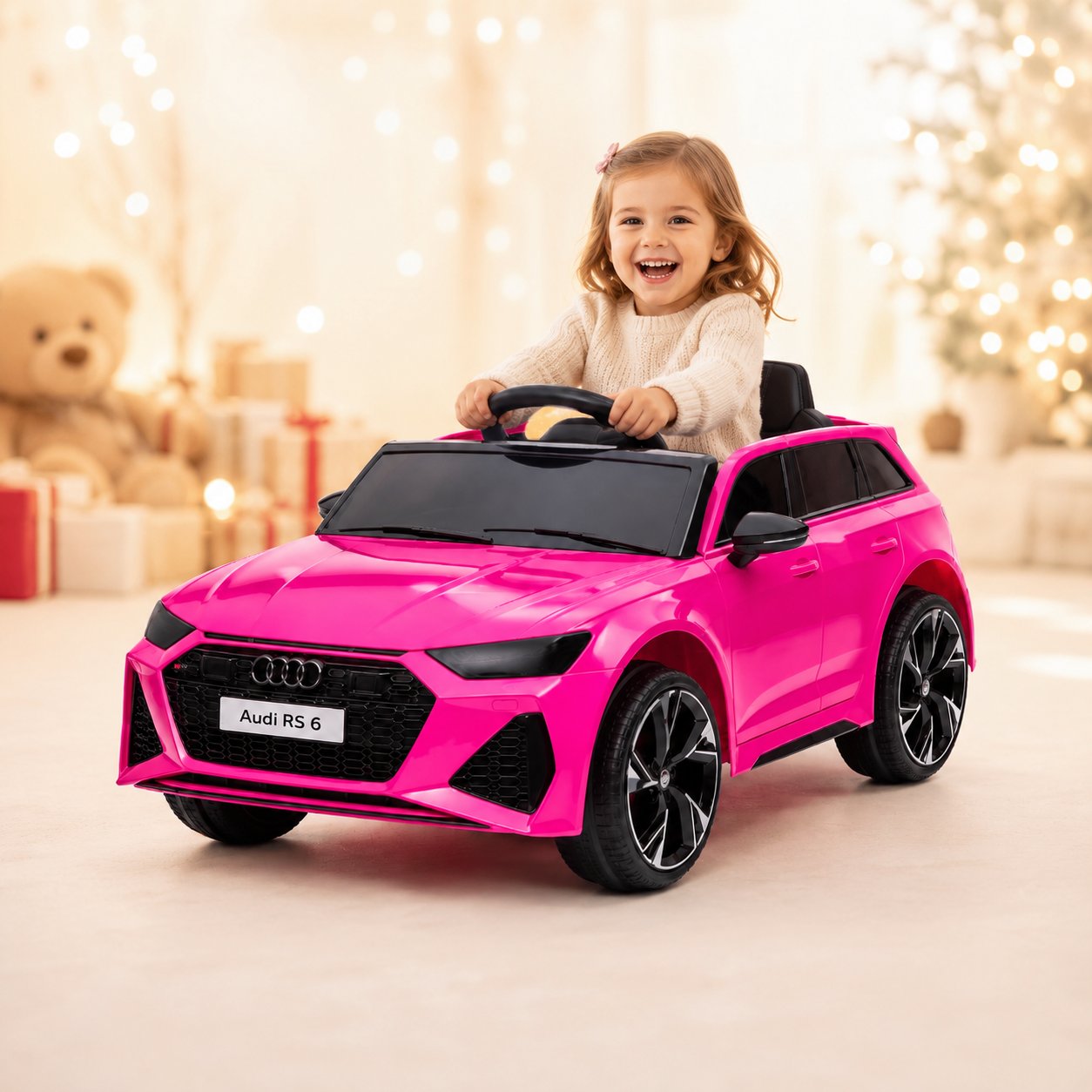 Meisje rijdt in roze Audi RS6 elektrische kinderauto